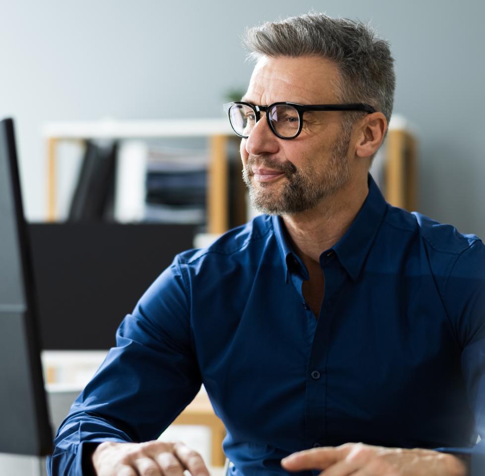 Online travel agency representative working on a computer.